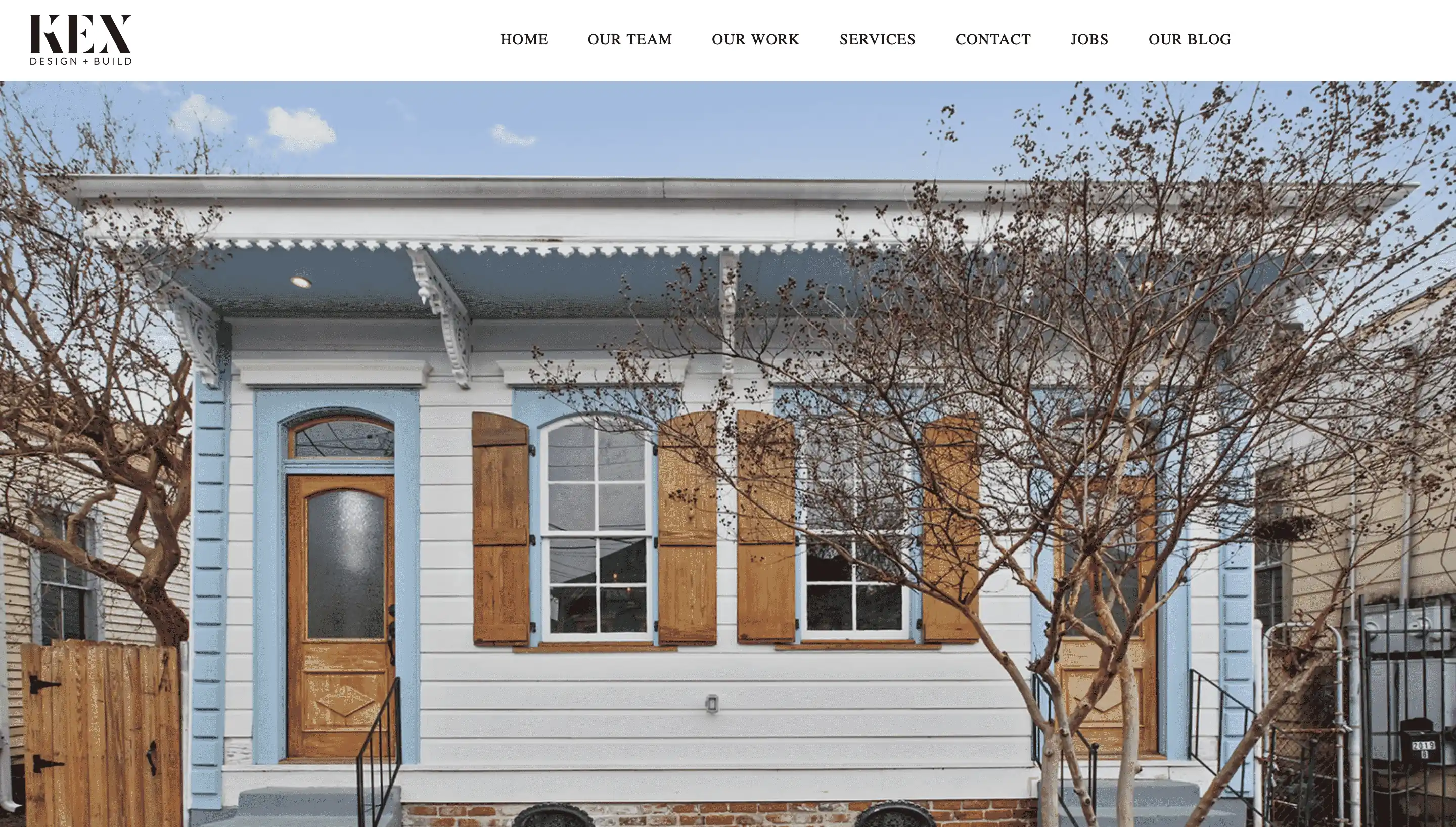 website homepage with navigation bar and an image of a house
